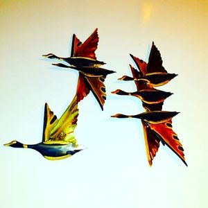 Vintage brass and copper toned wall hangings